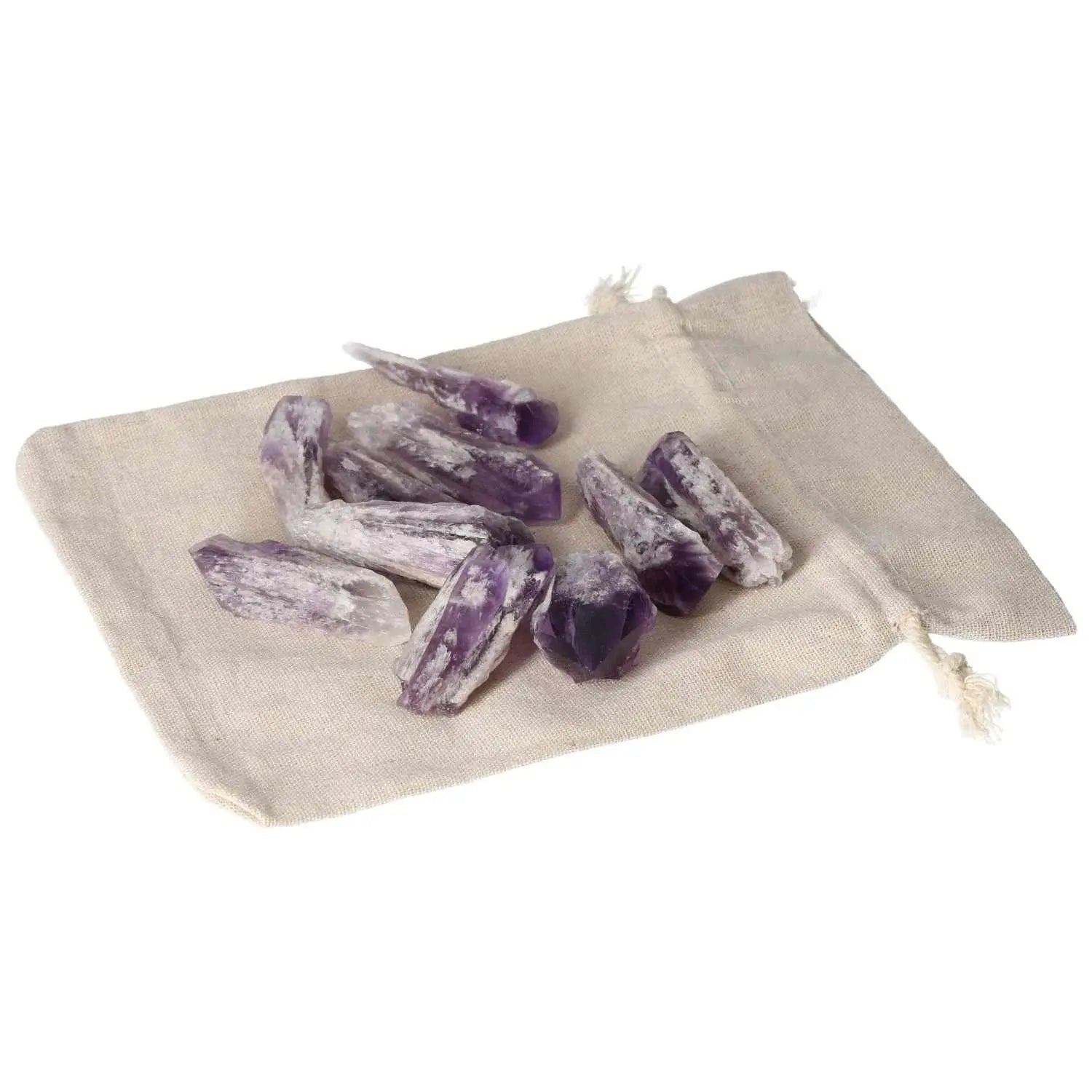 Amethyst Point S crystals from Sylvia Crystals on a beige bag, symbolizing serenity and elegance, ideal for stress reduction and focus.