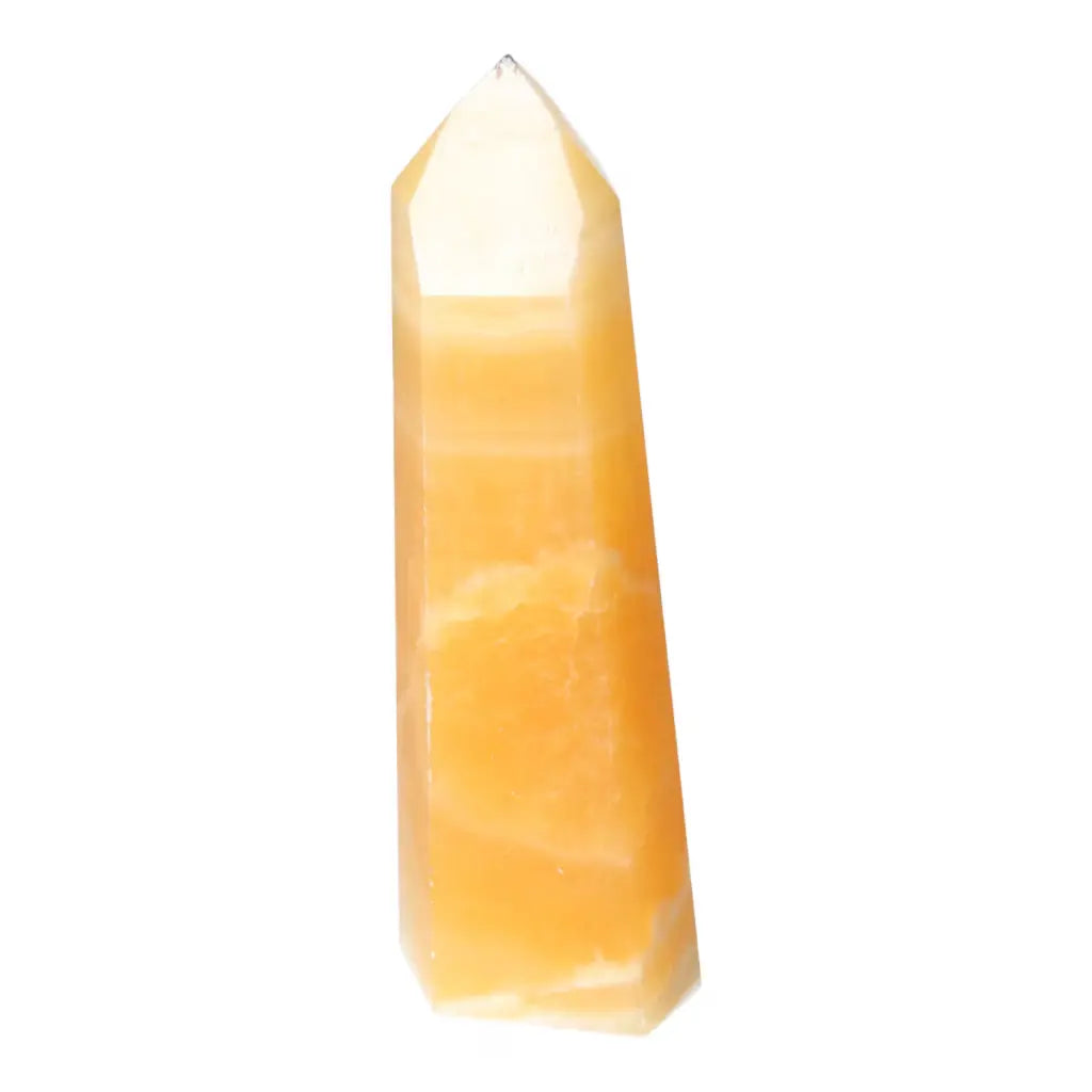 Mexican Calcite Obelisk from Sylvia Crystals, enhancing self-confidence and motivation; a handpicked symbol of spiritual elegance and luxury.