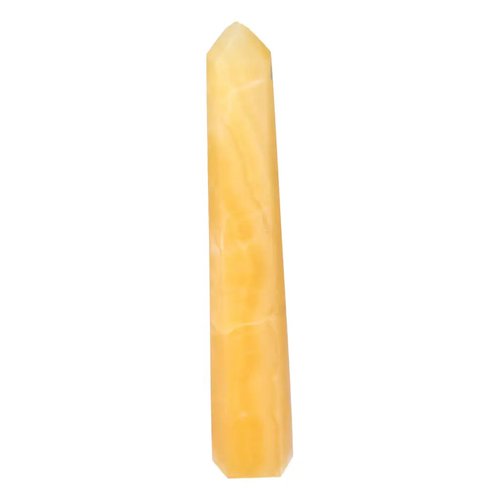 Mexican Calcite Obelisk from Sylvia Crystals, a premium stone for enhancing motivation and personal growth, on white background.