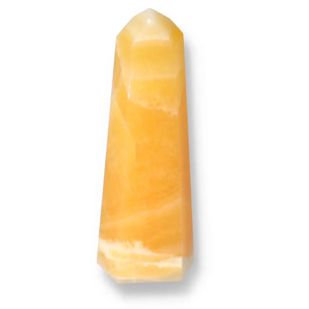 Mexican Calcite Obelisk by Sylvia Crystals, offering transformative energy and luxurious design for positivity and self-discovery.
