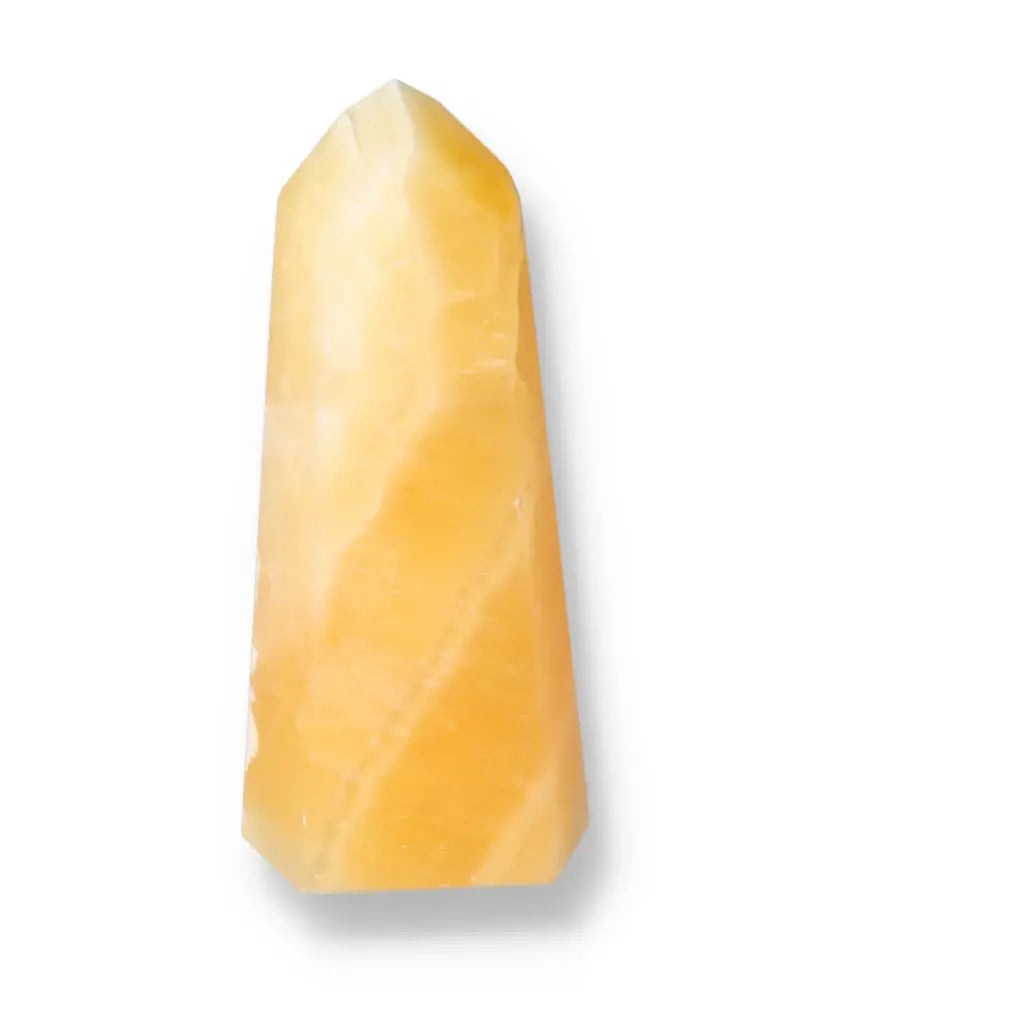Mexican Calcite Obelisk by Sylvia Crystals showcasing luxury and spirituality, enhancing self-confidence and motivation.