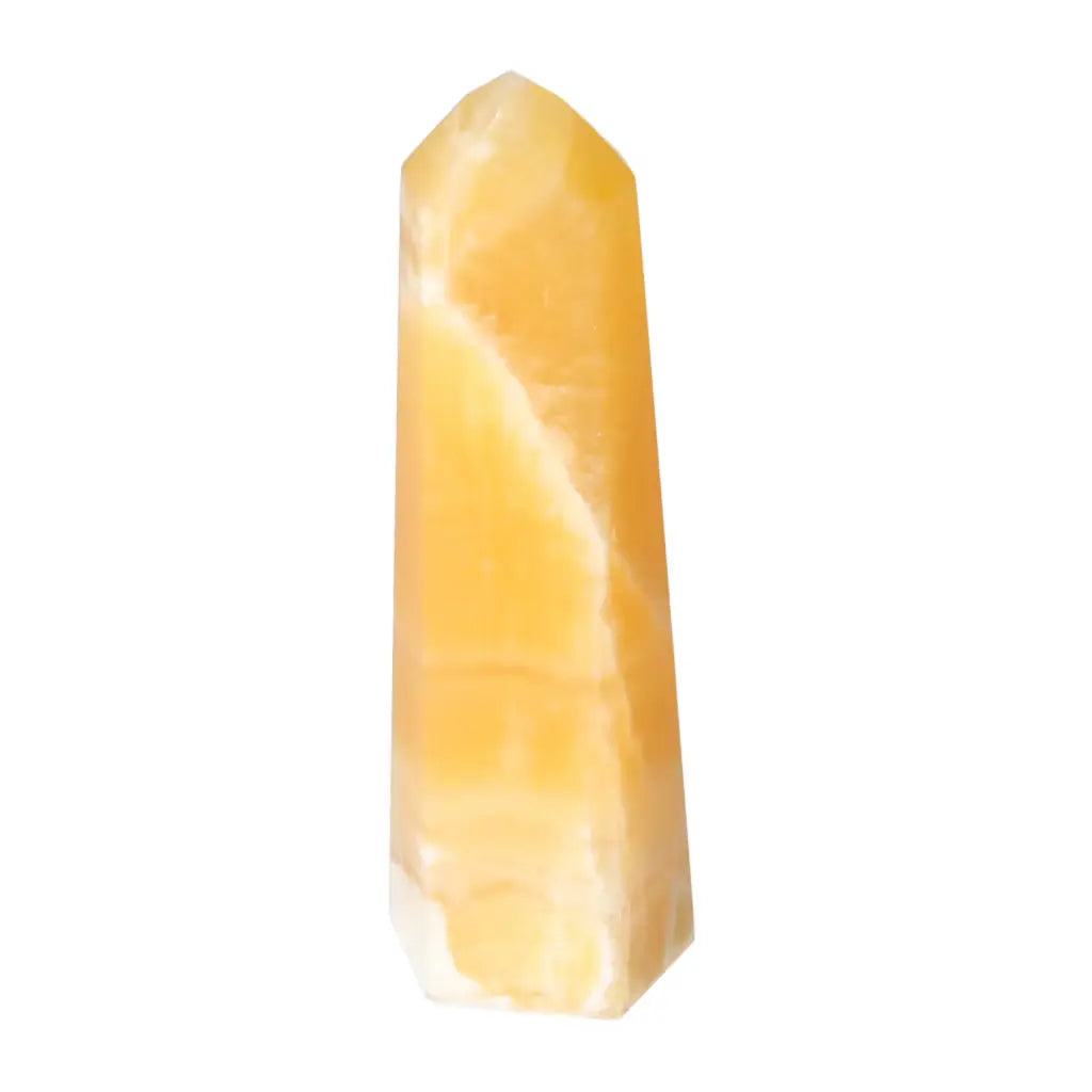 Mexican Calcite Obelisk from Sylvia Crystals, showcasing a luxurious and spiritual design for confidence and goal orientation.