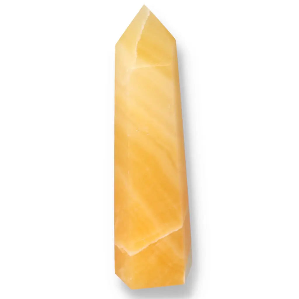 Mexican Calcite Obelisk from Sylvia Crystals, enhancing energy flow, concentration, and self-confidence with its elegant design.