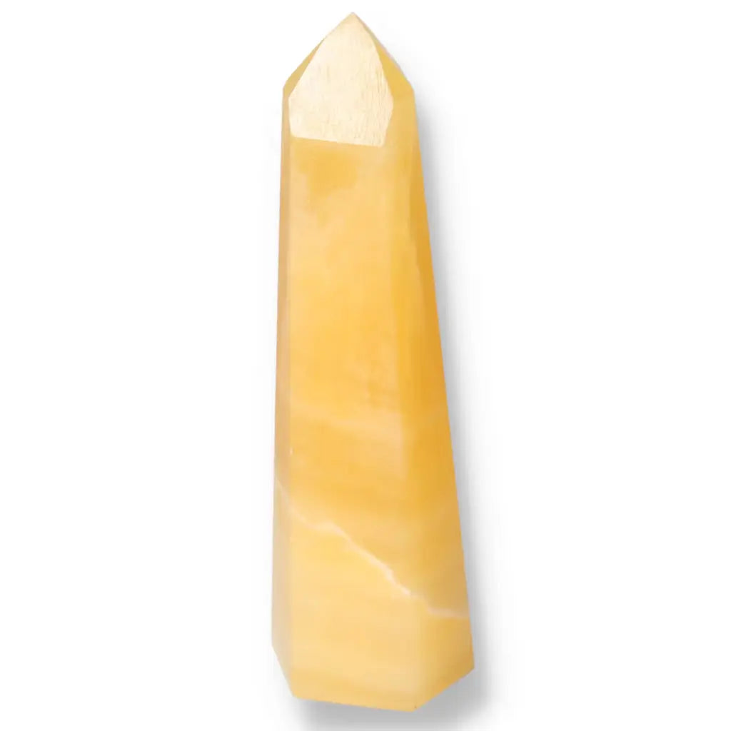 Mexican Calcite Obelisk from Sylvia Crystals showcasing a vibrant yellow hue, known for boosting positivity and self-confidence.