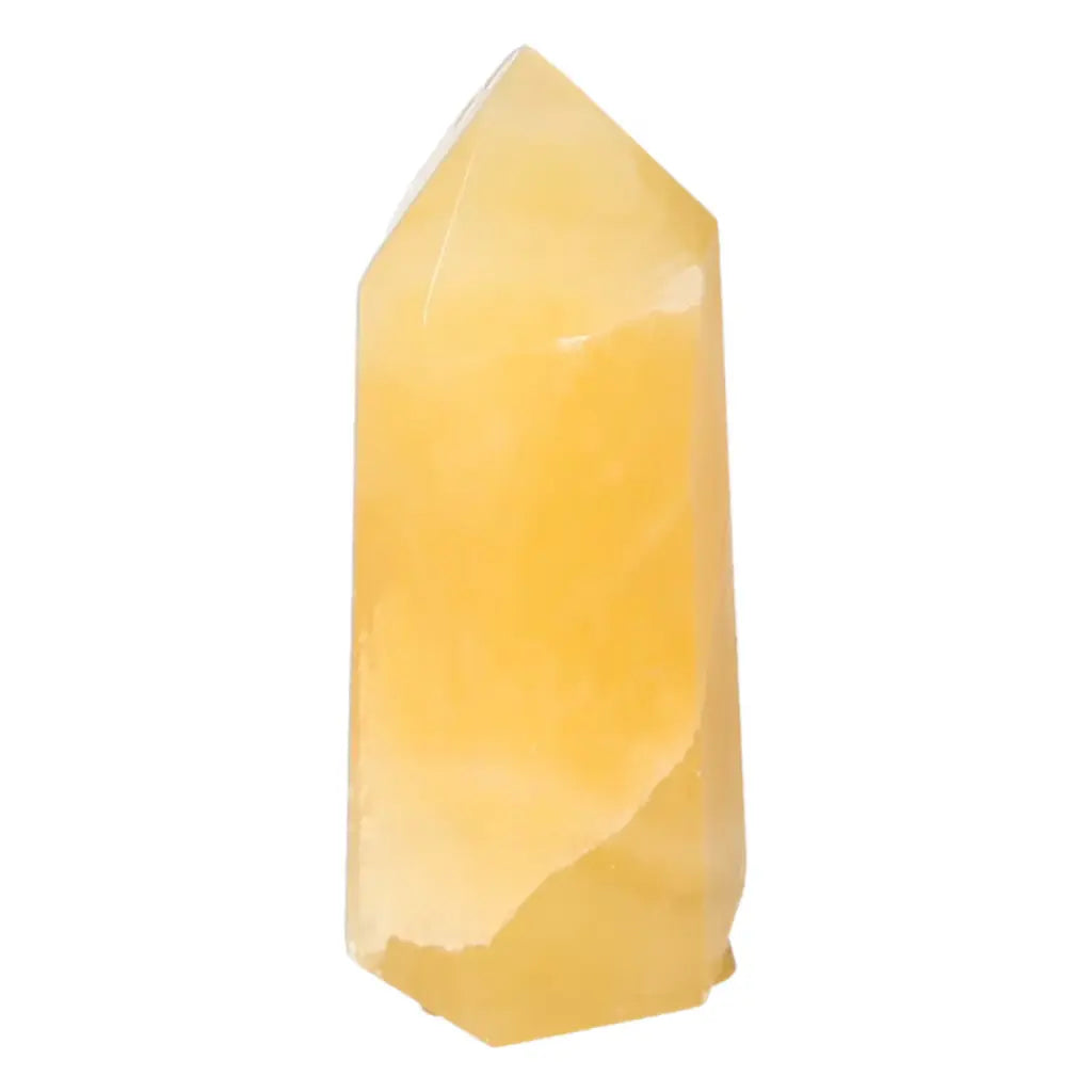 Mexican Calcite Obelisk crystal from Sylvia Crystals, enhancing self-confidence and spiritual allure in luxury spaces.
