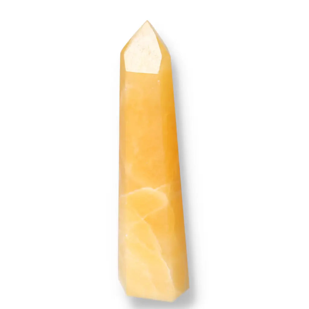 Mexican Calcite Obelisk from Sylvia Crystals, a handpicked decorative stone, enhances decor and boosts confidence and goal achievement.