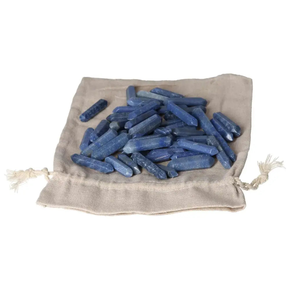 Blue Aventurine small sticks on a beige drawstring pouch, ideal for spiritual awakening and personal transformation.