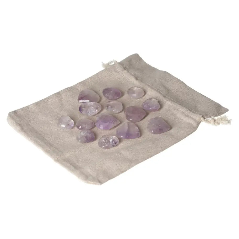 Amethyst small heart stones for stress relief and emotional stability, arranged in a linen pouch, perfect for boosting energy and focus.