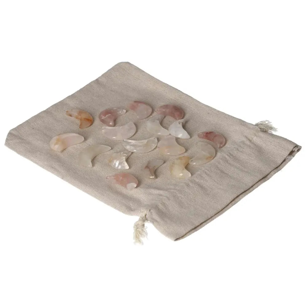 Golden Healer Small Moon stones on a beige cloth