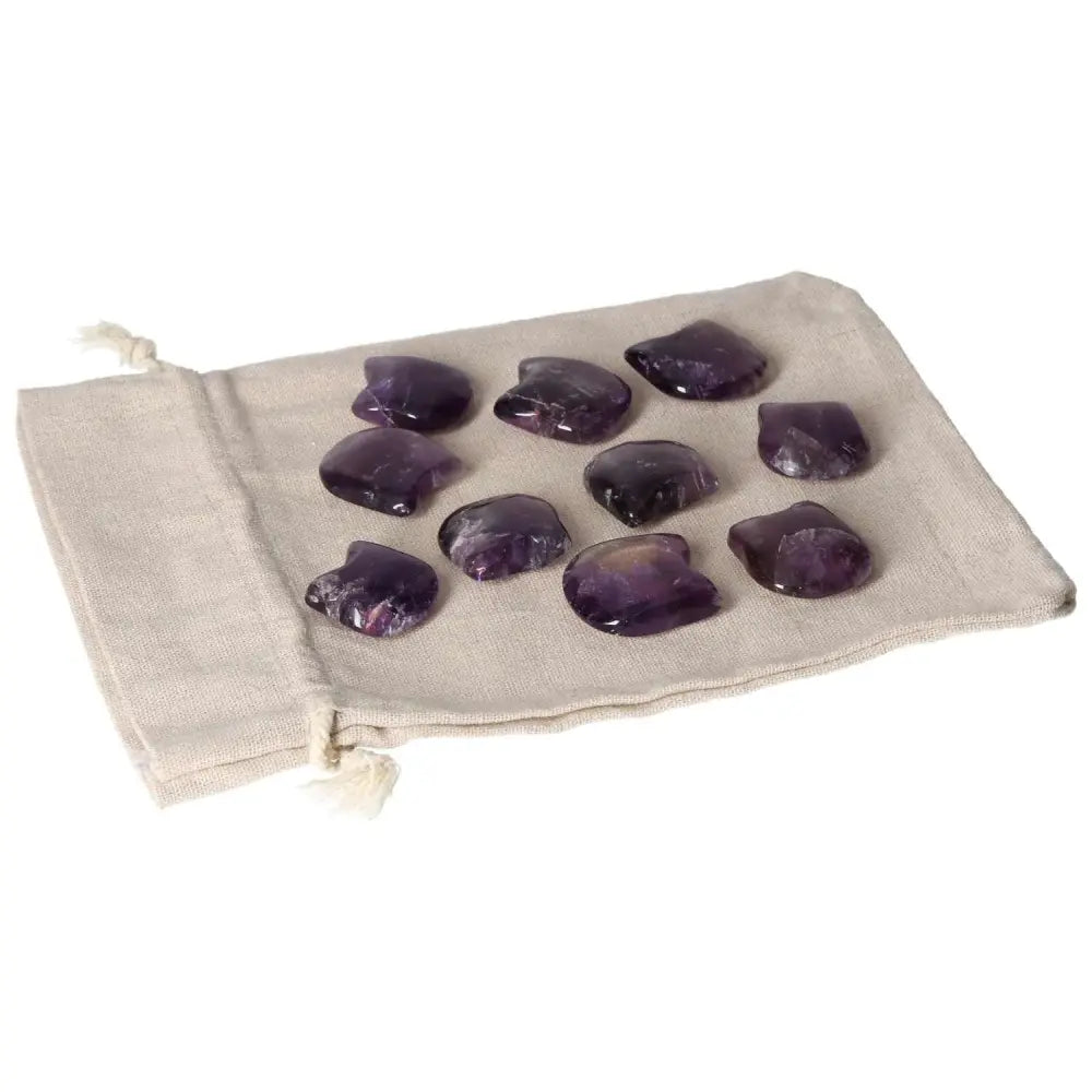 Amethyst small cat crystals on a cloth bag, promoting stress reduction, energy boost, concentration, and emotional stability.