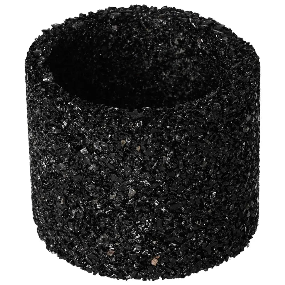 Black tourmaline candle holder with textured surface, offering spiritual harmony and decorative elegance.