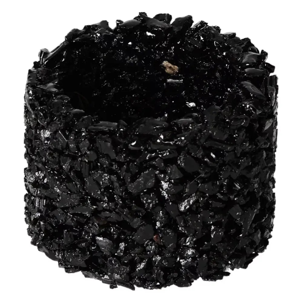 Black decorative pot cover made of tourmaline crystals from Sylvia Crystals, known for enhancing mental balance and energy transformation.
