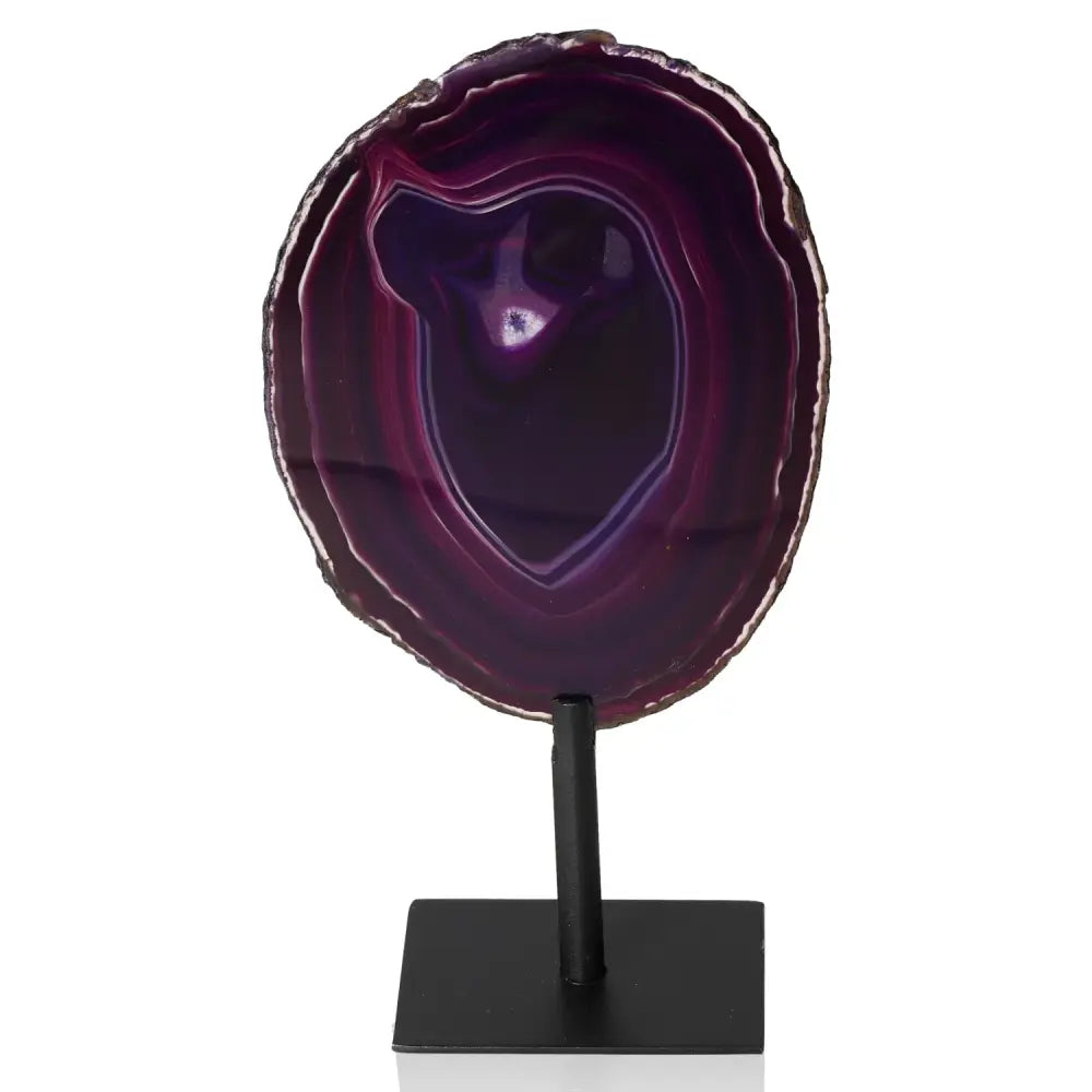 Purple agate slice on metal stand, showcasing polished layers and natural beauty, perfect for enhancing interior tranquility.