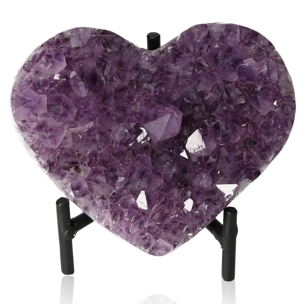 Amethyst Heart gemstone on black stand, known for reducing stress and enhancing concentration, providing tranquility and emotional stability.