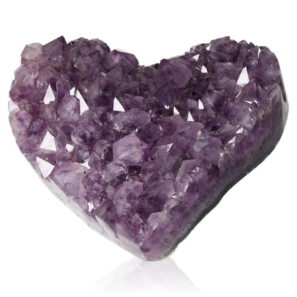 Heart-shaped amethyst gemstone with deep purple crystals for emotional balance and tranquility.