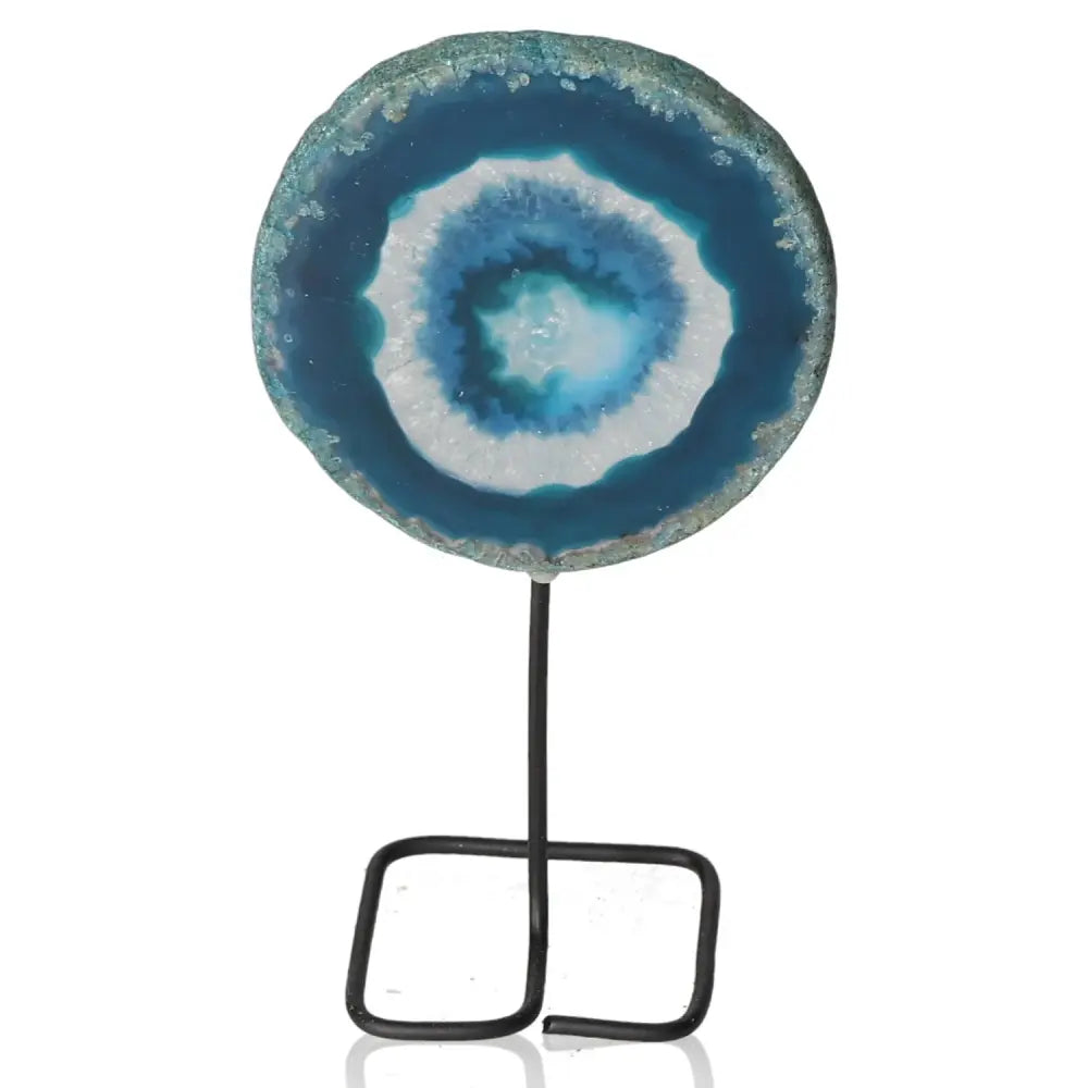 Blue agate slice on metal stand showcases natural elegance and unique design for home decor.