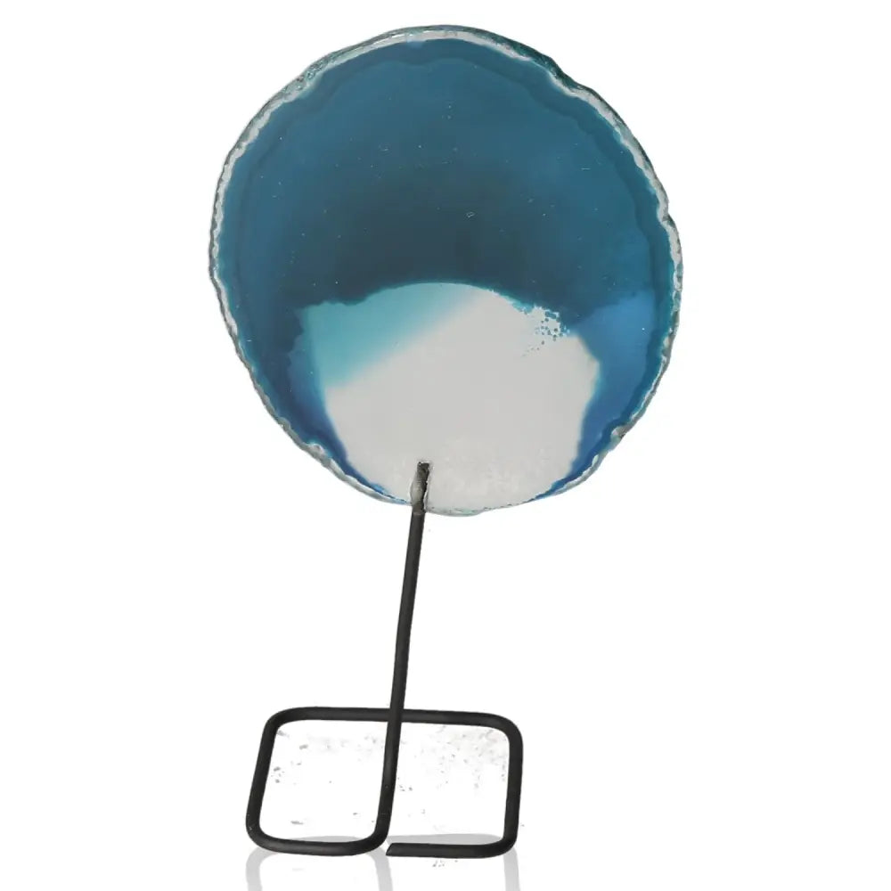 Blue agate slice on decorative metal stand, showcasing natural beauty and modern elegance for home or office decor.