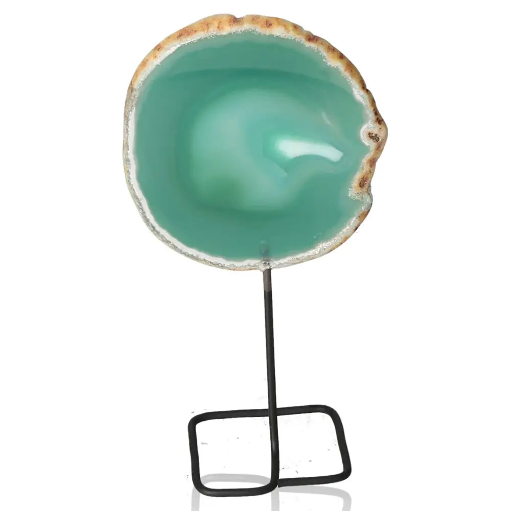 Green agate slice with unique patterns on metal stand, perfect for home decor and aesthetic enhancement.