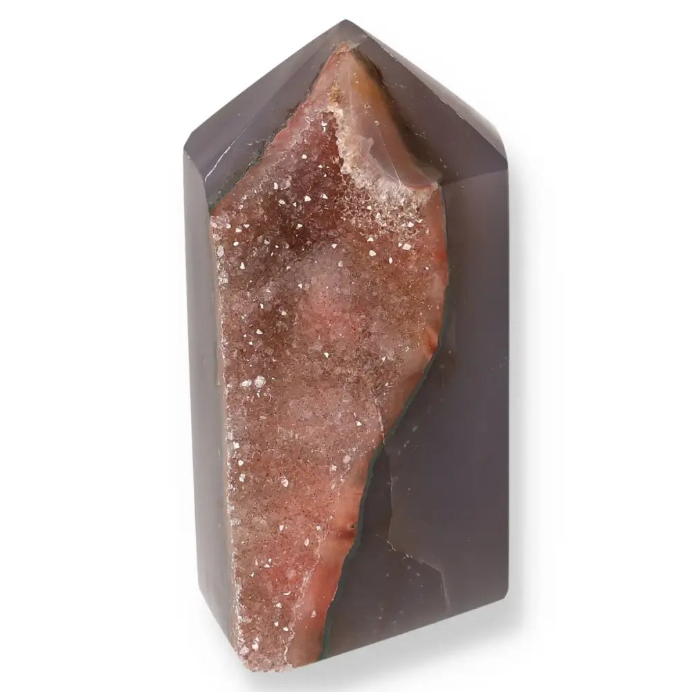 Agate Geoded Point showcasing intricate natural patterns and colors, offering beauty and spiritual balance for wellness seekers.