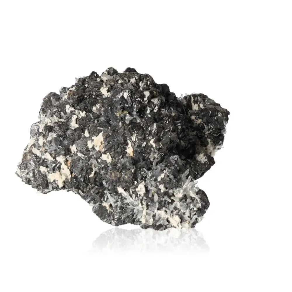 Raw sphalerite mineral gemstone with black and white texture, used in jewelry and spiritual healing practices.