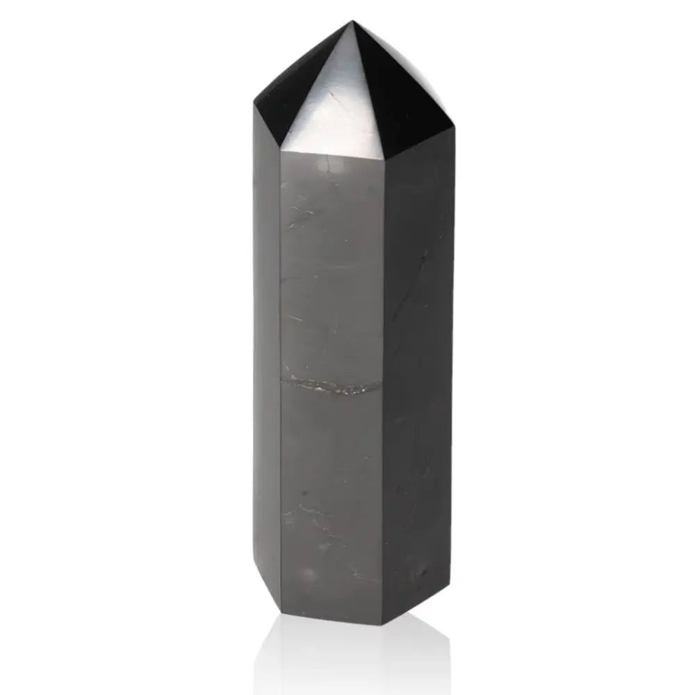 Elegant 10 cm Shungite Obelisk with healing and protective properties, symbolizing luxury and craftsmanship, by Sylvia Crystals