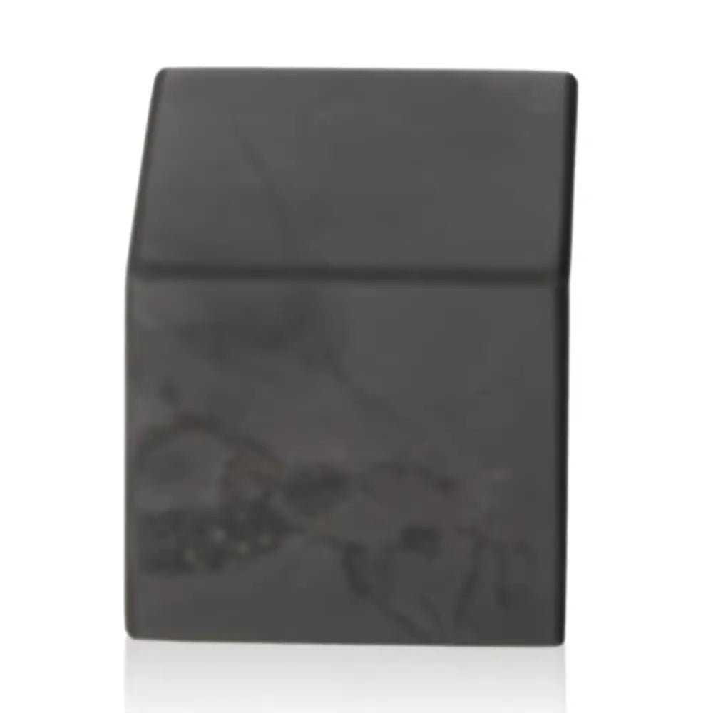 Shungite Cube 6 cm from Sylvia Crystals, symbolizing strength and luxury, perfect for enhancing modern spaces with its sleek design.