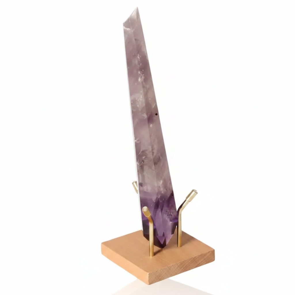 Natural Amethyst Point on wooden stand, showcasing its vibrant purple hues and spiritual connection to the crown chakra.
