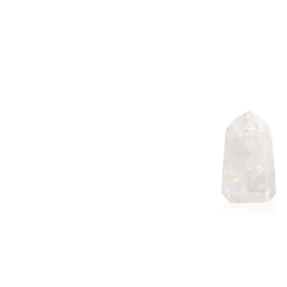 Lemurian Quartz Obelisk by Sylvia Crystals, a spiritual tool for energy amplification and purity, set against a minimalistic background.