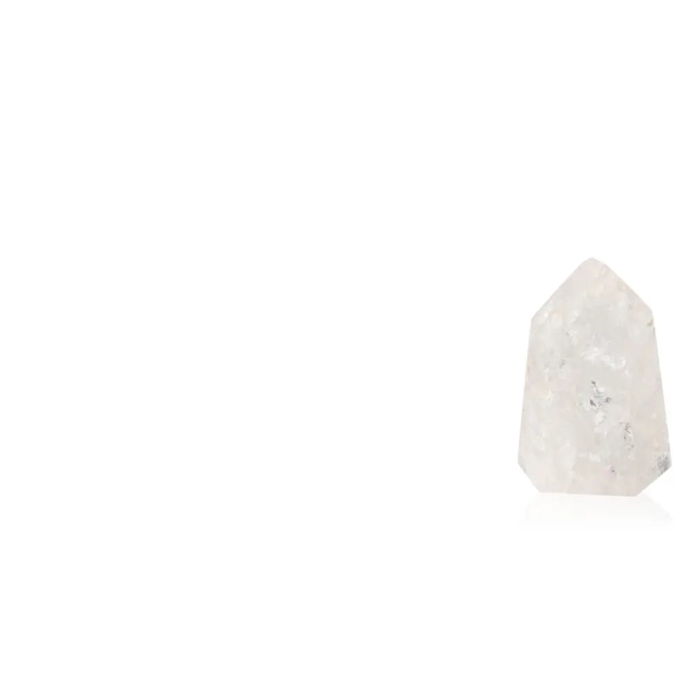 Lemurian Quartz Obelisk by Sylvia Crystals showcasing natural clarity and spiritual energy, perfect for luxurious spiritual decor.