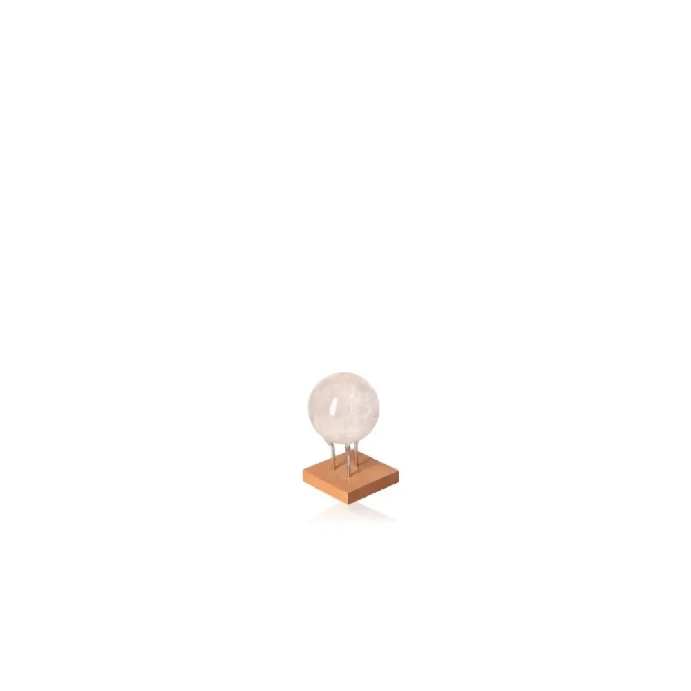 Lemurian Quartz Sphere on wooden stand from Sylvia Crystals, designed to enhance spiritual energy and bring serenity to your space.