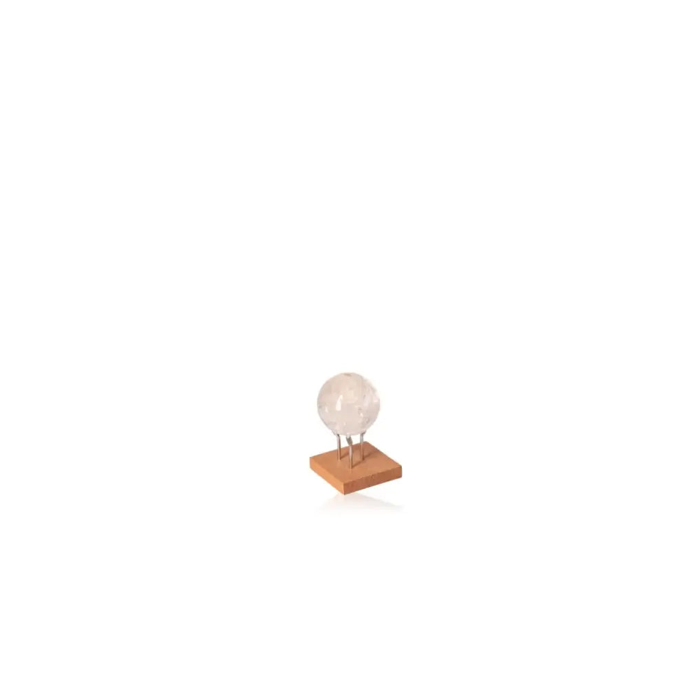Lemurian Quartz Sphere on a wooden stand, featuring clarity and energy-enhancing properties for tranquility and healing.