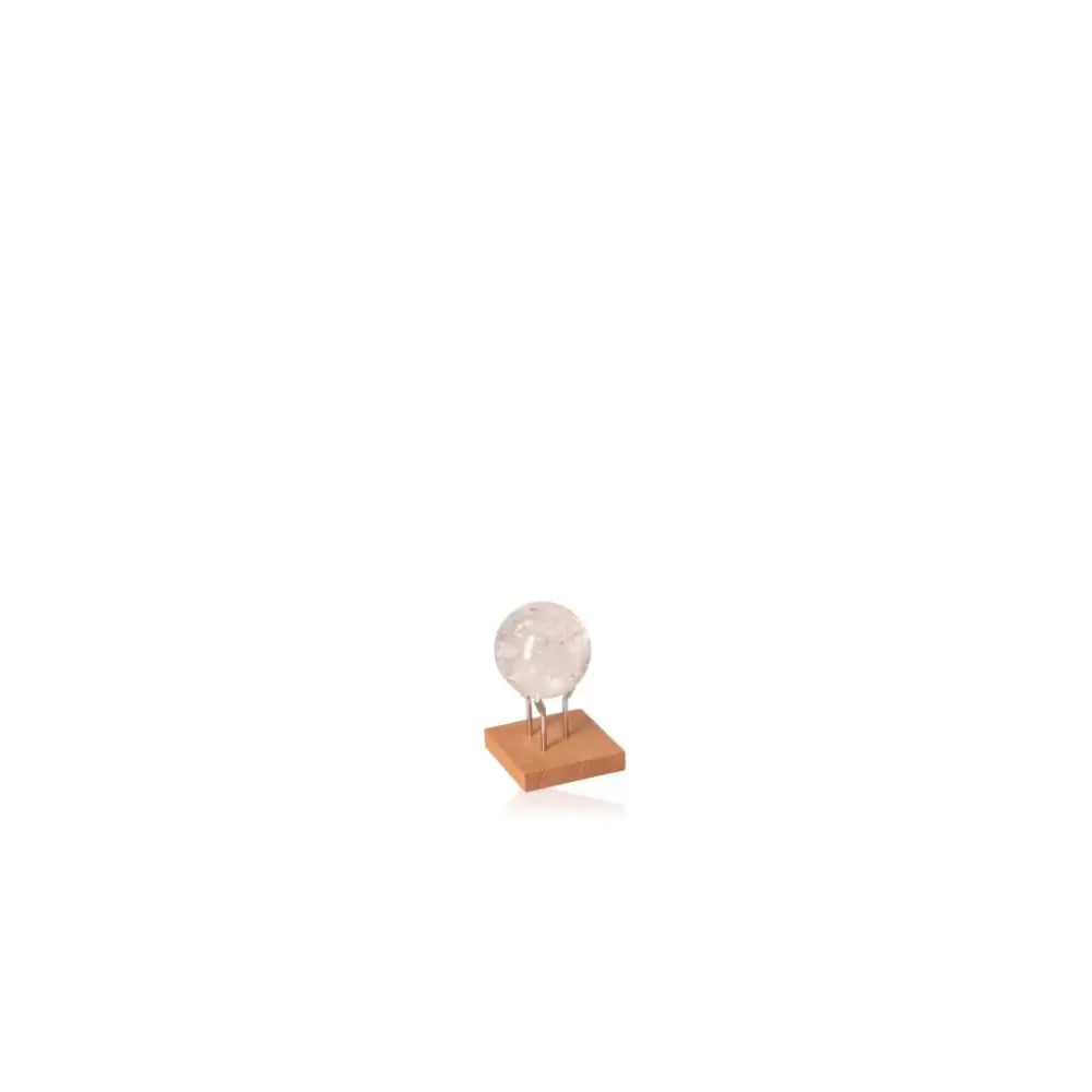 Lemurian Quartz Sphere with clear crystal on wooden stand, enhancing energy flow and tranquility in any space.