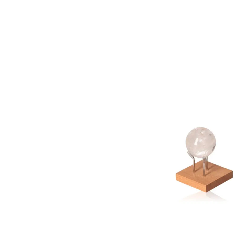 Lemurian Quartz Sphere on stand, elevating spiritual journeys, a luxurious gemstone by Sylvia Crystals known for its profound energy.