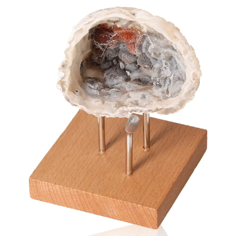 Mini Agate Geode on wooden stand, showcasing its natural elegance and tranquil energy harmonizing features.