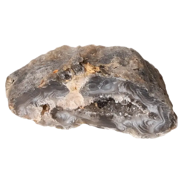 Mini Agate Geode displaying natural patterns and calming colors, known for its tranquil and balancing properties in harmonious spaces.