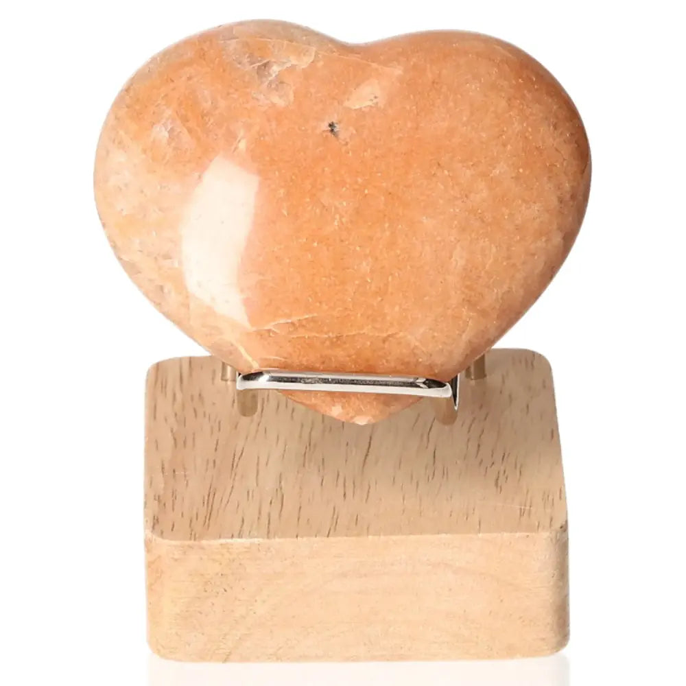 Peach Moonstone Heart Crystal on Stand, promotes emotional balance, intuition, and restful sleep, ideal for enhancing sensitivity.
