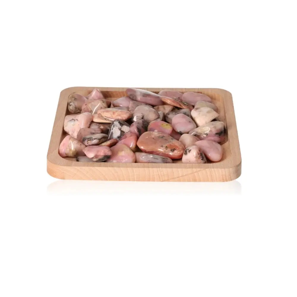 Tray of tumbled opal crystals for stimulating love, reigniting passion, and enhancing cosmic consciousness.