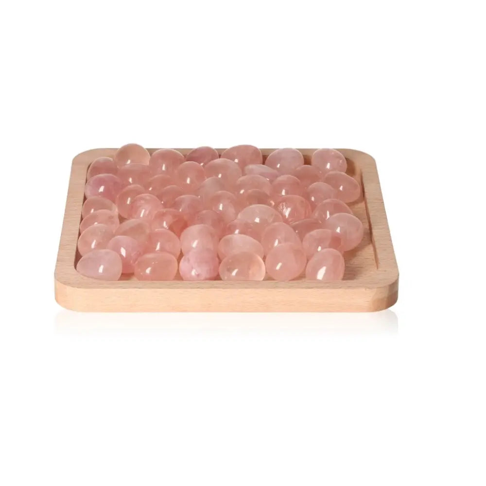 Tray of tumbled rose quartz stones from Sylvia Crystals, ideal for emotional healing and self-love, ethically sourced and natural.