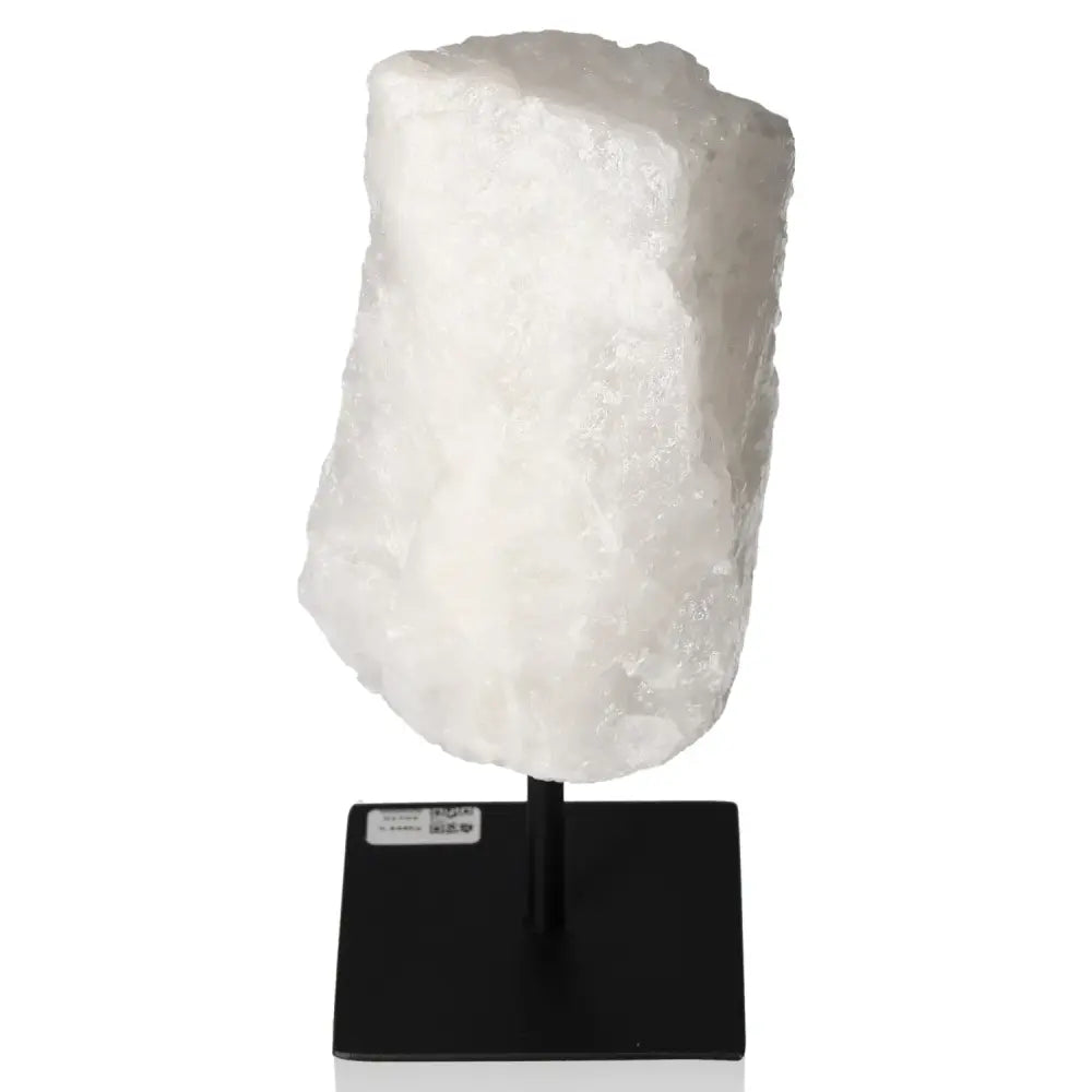 Cut Milky Quartz on Metal Stand from Sylvia Crystals, featuring ethereal cloudy opacity, perfect for spiritual and decorative purposes.