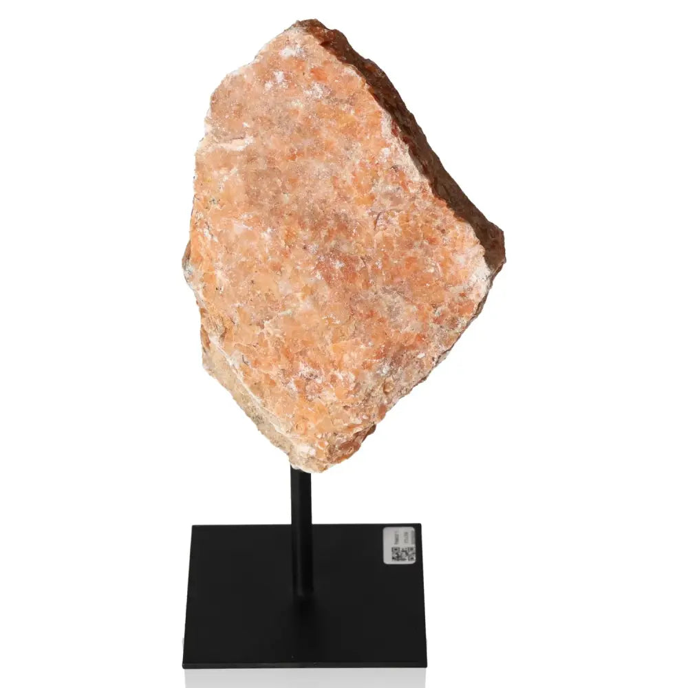 Orchid Calcite gemstone on metal stand, showcasing vibrant orange and pink tones. Ideal for motivation and creativity.