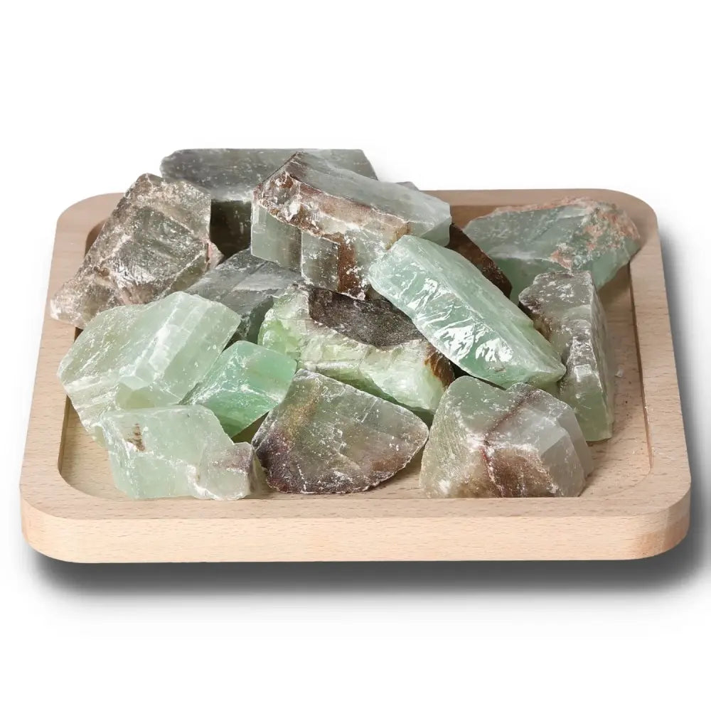 Alt Tag: Rough green calcite crystals in a wooden tray, enhances self-confidence, motivation, and concentration, ideal for learning and energy.