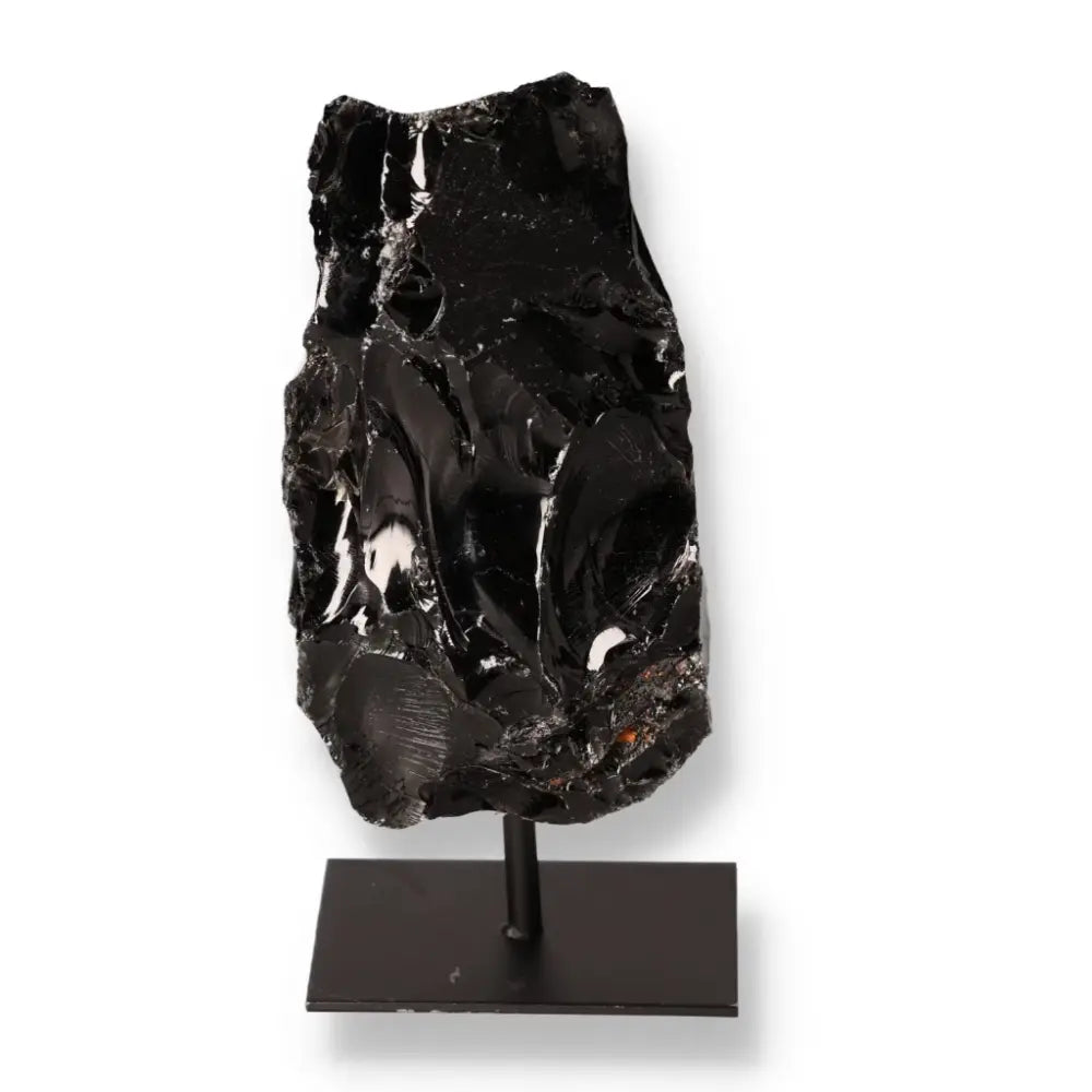 Black Obsidian on Metal Stand, a protective mineral to absorb and neutralize negative energies, enhancing your environment's aura.