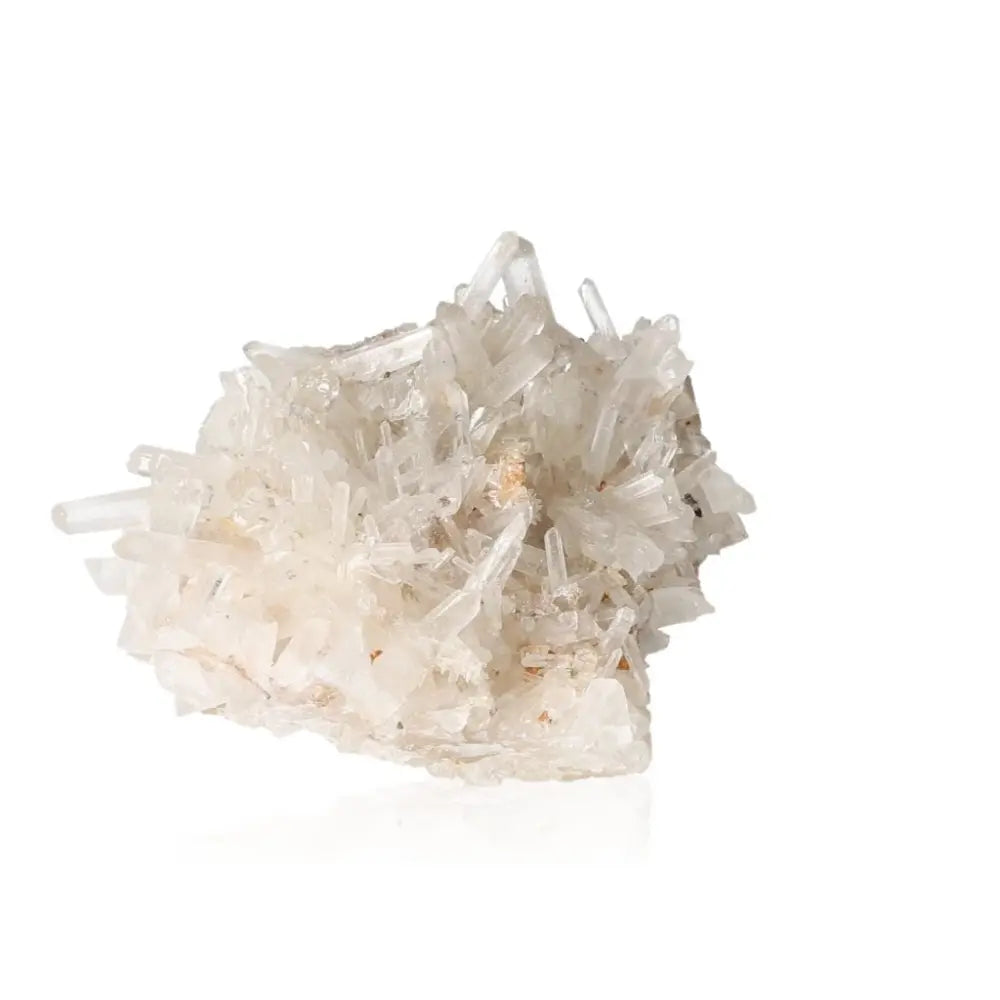Clear quartz crystal cluster showcasing natural transparency and healing energy properties on a white background.