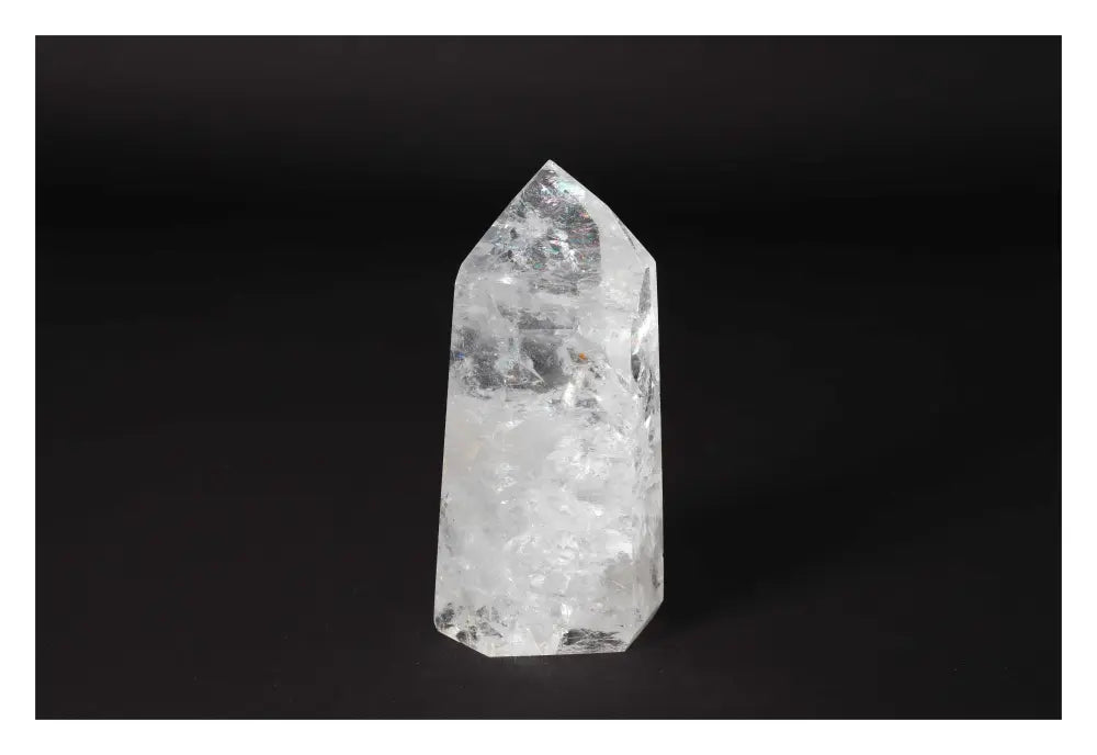 Clear crystal quartz point from Sylvia Crystals, showcasing exceptional clarity and energy for healing and spiritual growth.