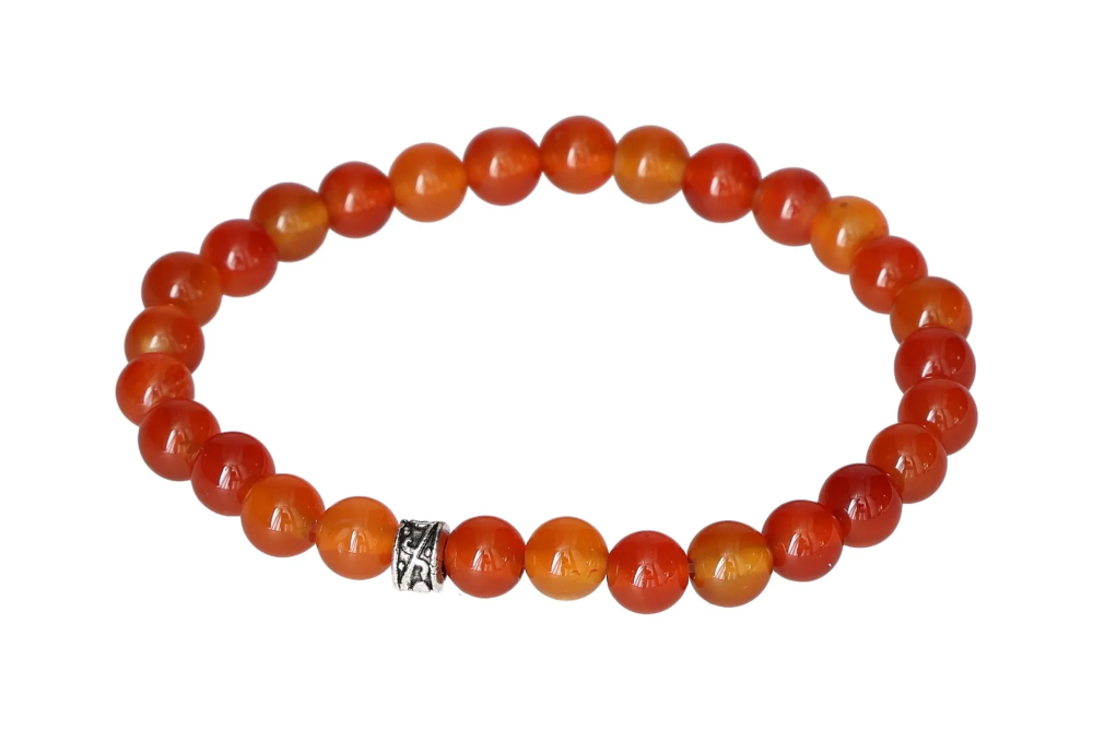 Carnelian 6 mm Bracelet 17 cm 634359 P10 featuring warm orange to reddish tones with polished beads on a stretchy band.