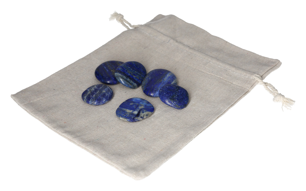 Lapis Lazuli Smooth Stone 634564 P10 set on a beige fabric pouch, showcasing polished blue stones for creativity and clarity enhancement.