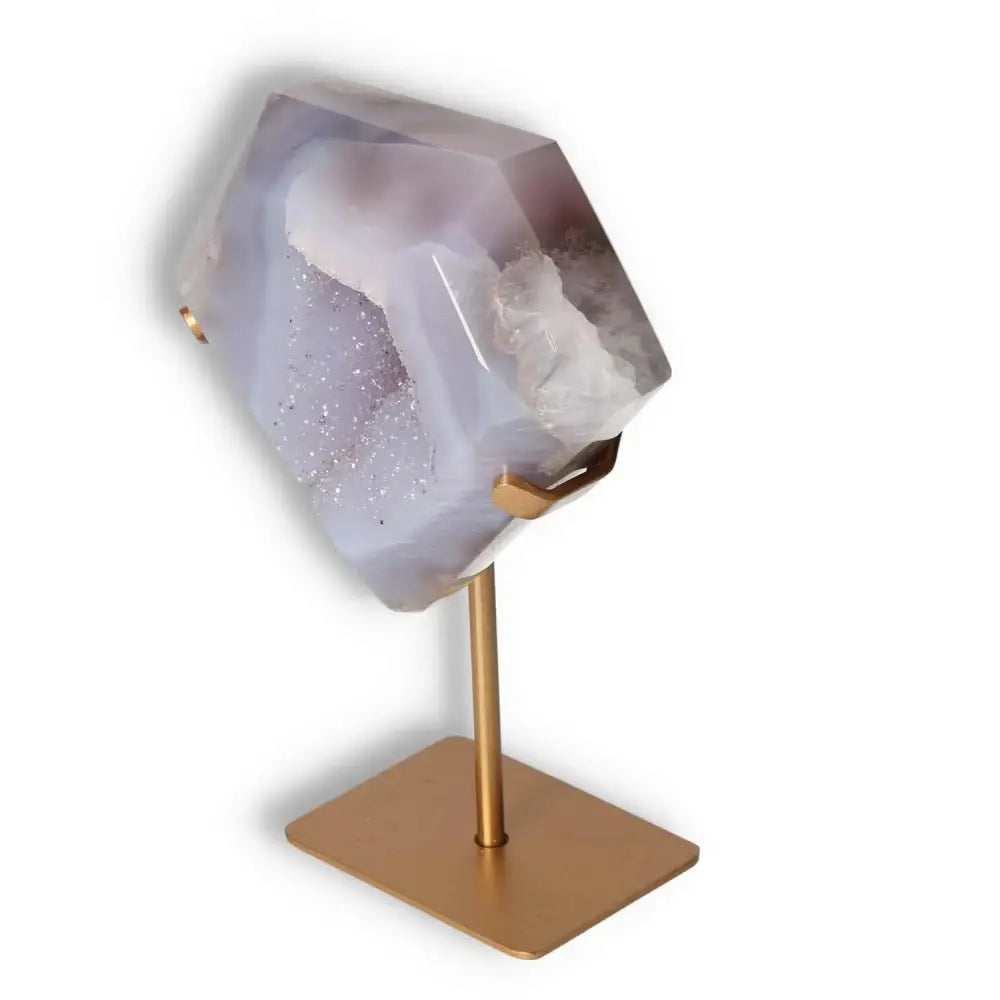 Agate decoration with stand showcasing natural patterns, polished surface, and delicate crystalline formations.
