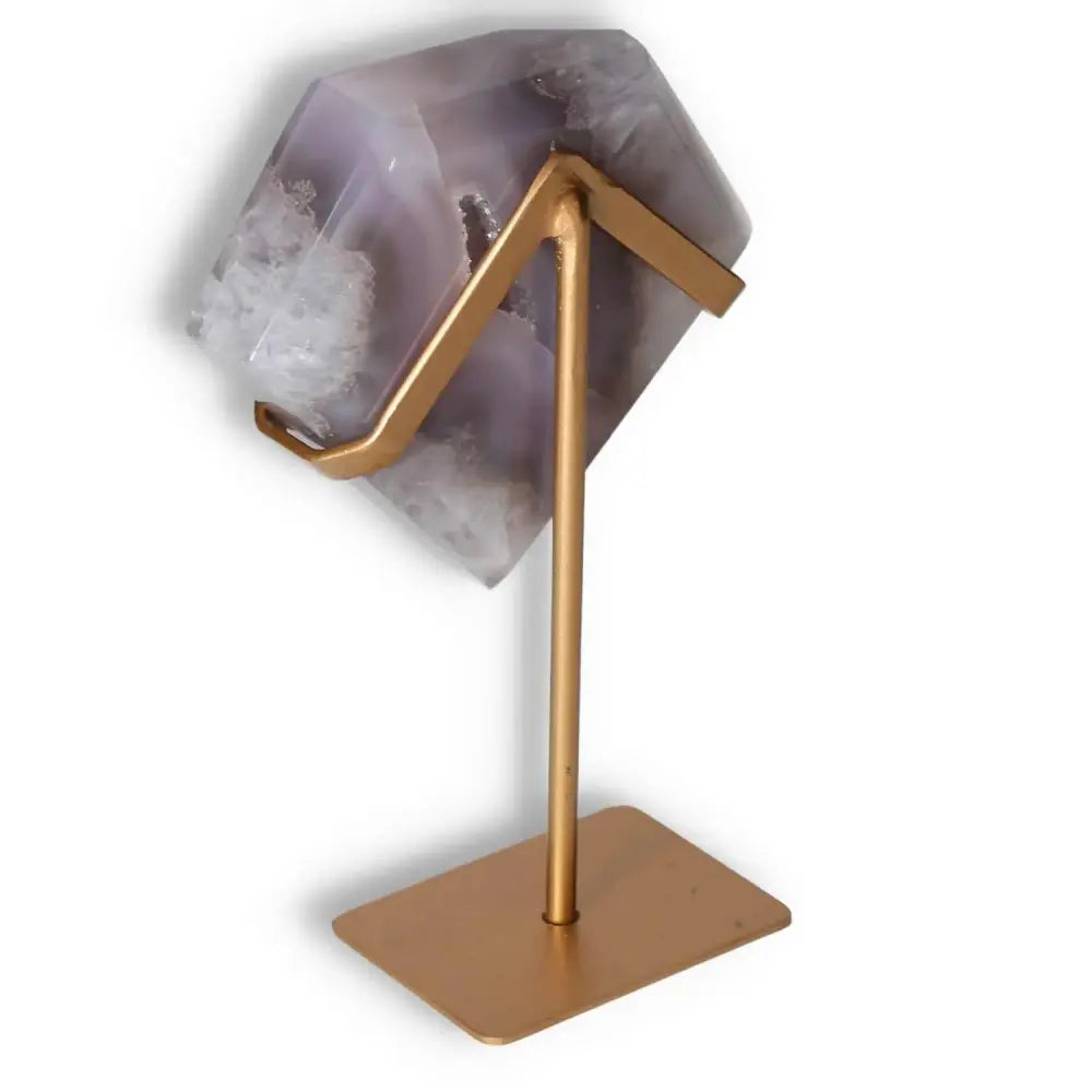 Agate decoration with stand showcasing natural patterns and translucency, featuring polished surfaces and unique veining.