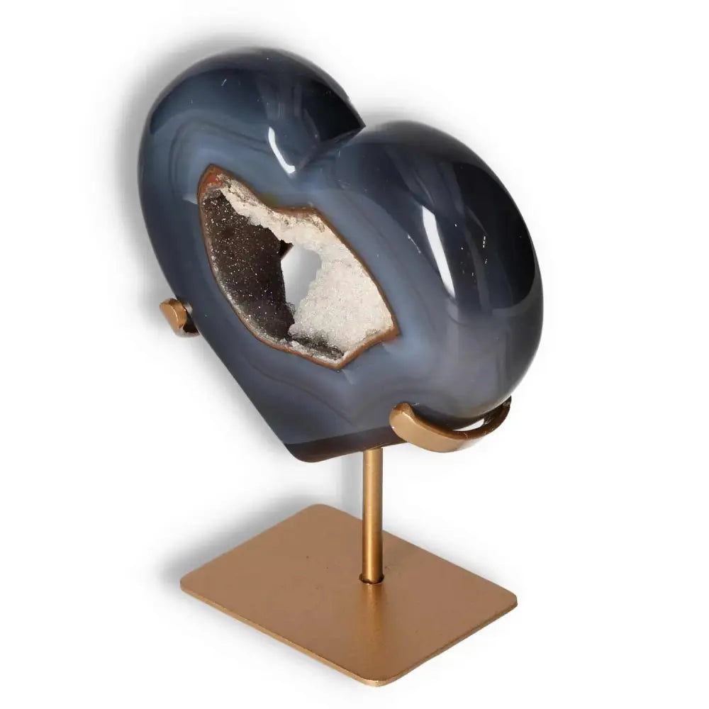 Elegant Agate Heart on stand by Sylvia Crystals, showcasing unique energy harmonizing properties and luxurious decorative appeal.