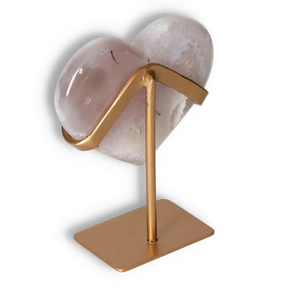 Agate Heart by Sylvia Crystals on elegant stand, exuding elegance and energy harmony.